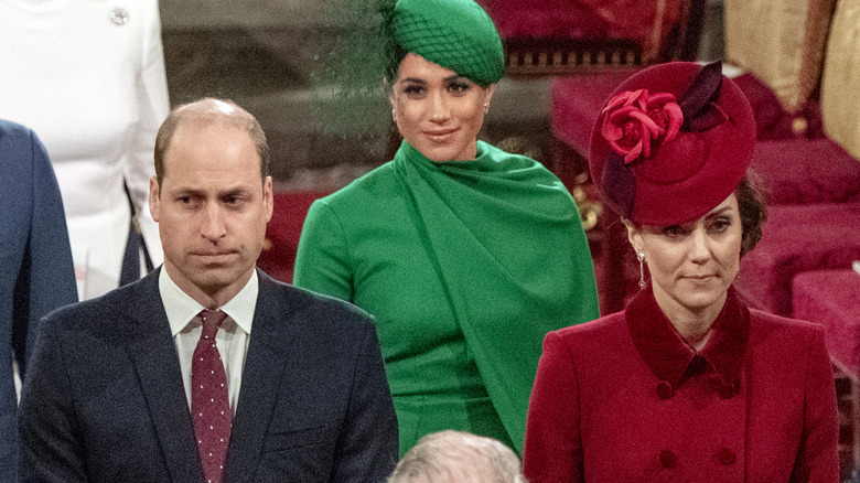 Prince William, Meghan Markle, and Kate Middleton frowning