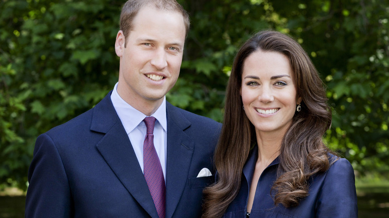 Prince William and Kate Middleton smiling outdoors