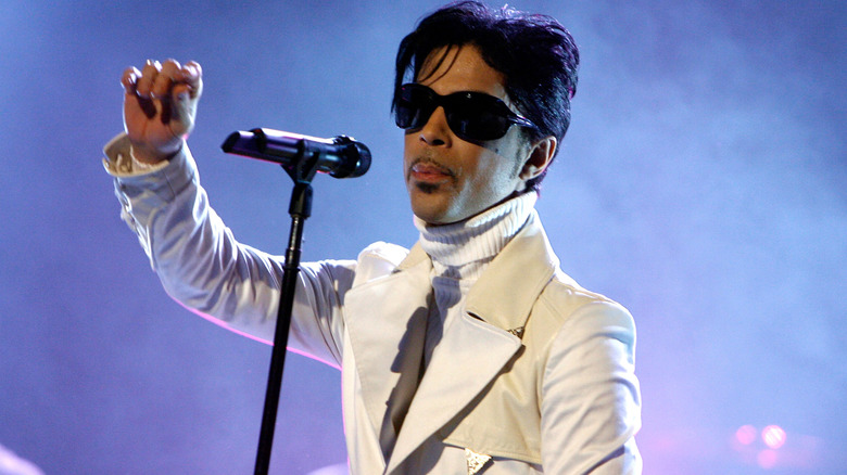 Prince wearing all white on stage