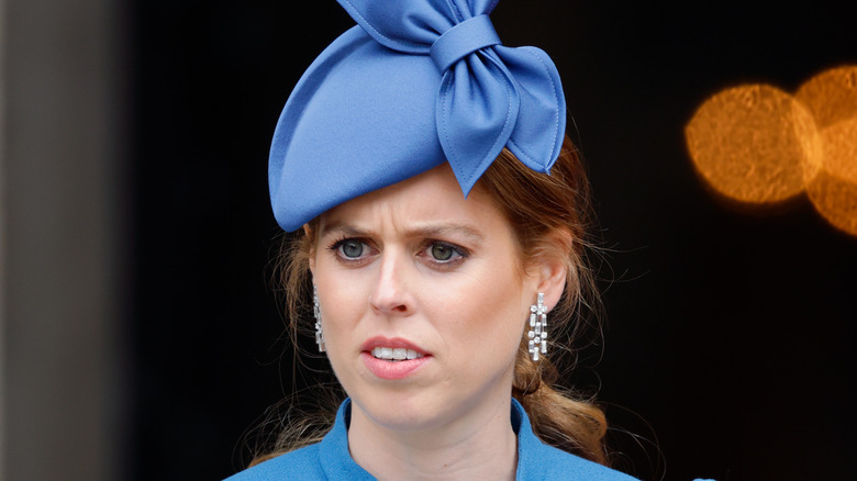Princess Beatrice blue hat sad