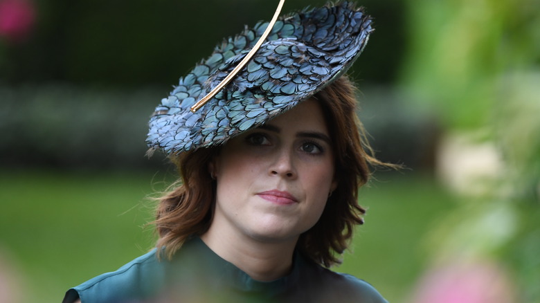 Princess Eugenie wearing blue feathered hat