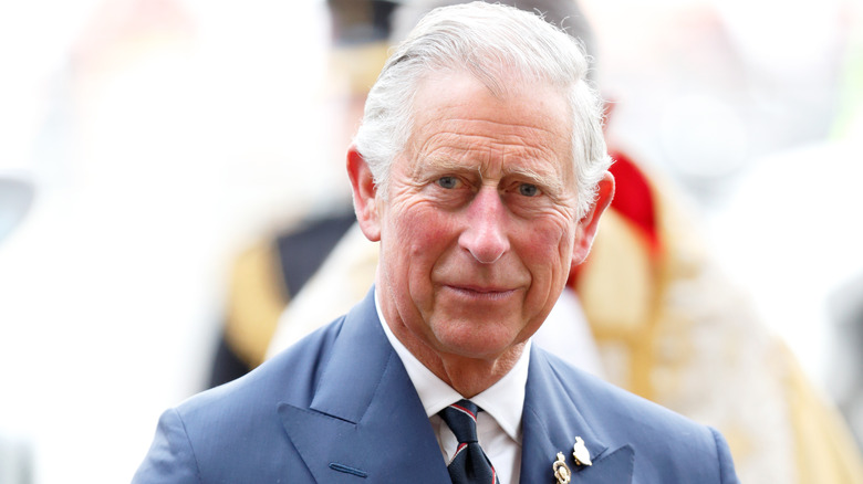 King Charles III wearing a blue suit