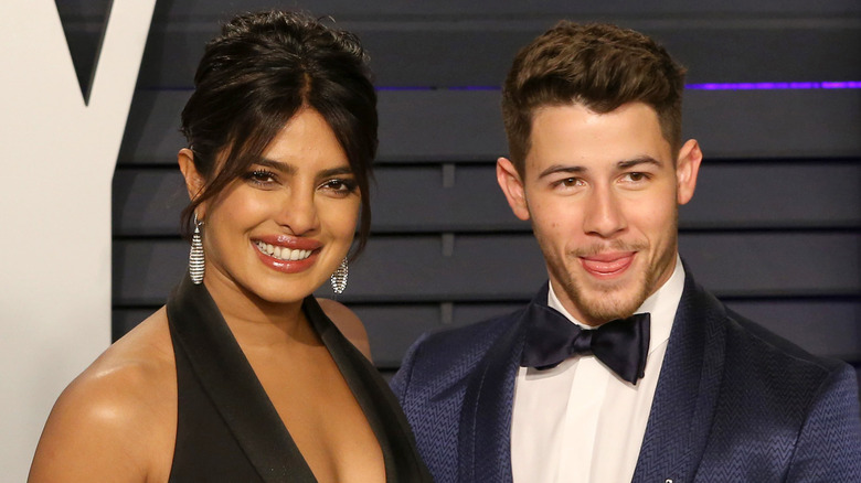 Priyanka Chopra and Nick Jonas posing at an event