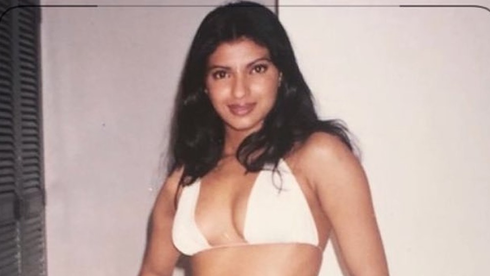Priyanka Chopra poses in a red dress in 2008.