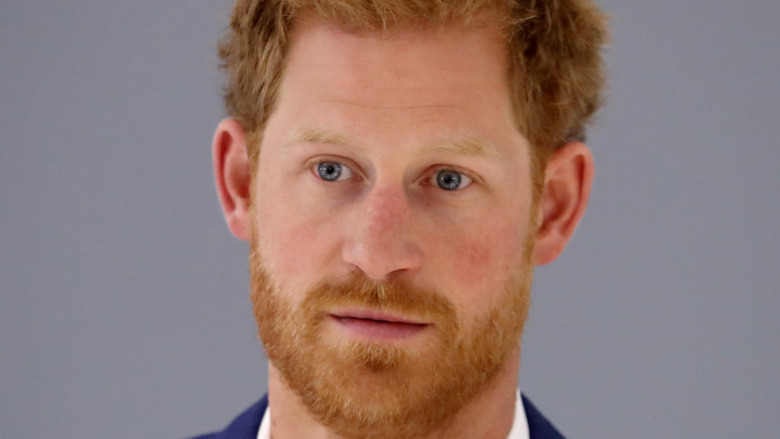 Prince Harry stares into the camera 