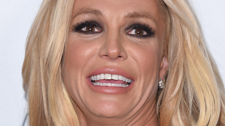 Britney Spears smiles looks up