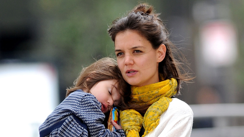 Katie Holmes holding Suri Cruise