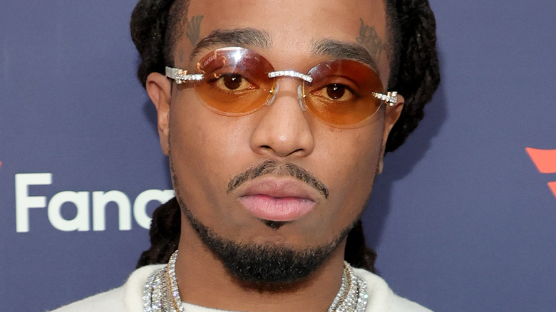 Quavo slightly smiling