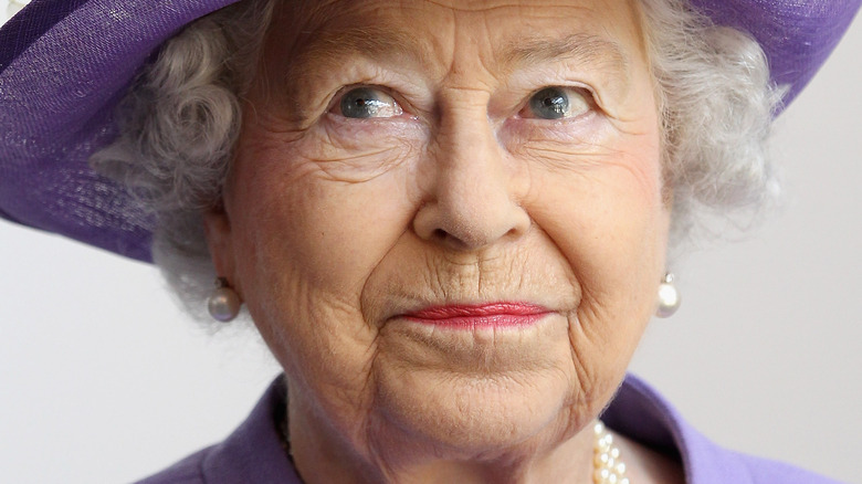 Queen Elizabeth II smirking