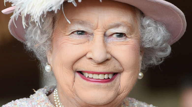 queen elizabeth feathered pink top hat