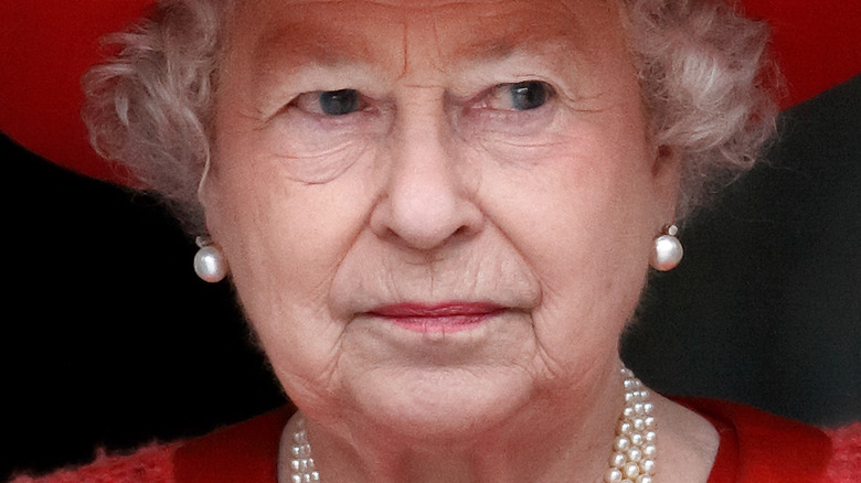 Queen Elizabeth II pursing her lips
