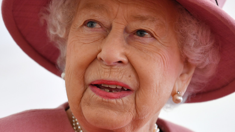 Queen Elizabeth smiles at an engagement