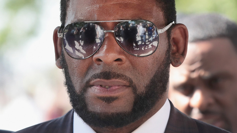 R Kelly looking serious in sunglasses
