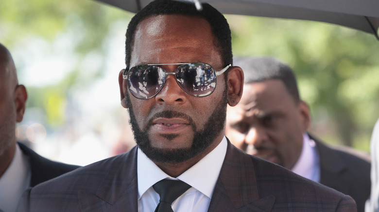 R. Kelly sunglasses under umbrella
