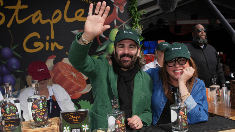 John Cusimano and Rachael Ray wearing matching green hats at the Food Network New York City Wine & Food Festival presented by Capital One - Grand Tasting featuring Culinary Demonstrations.