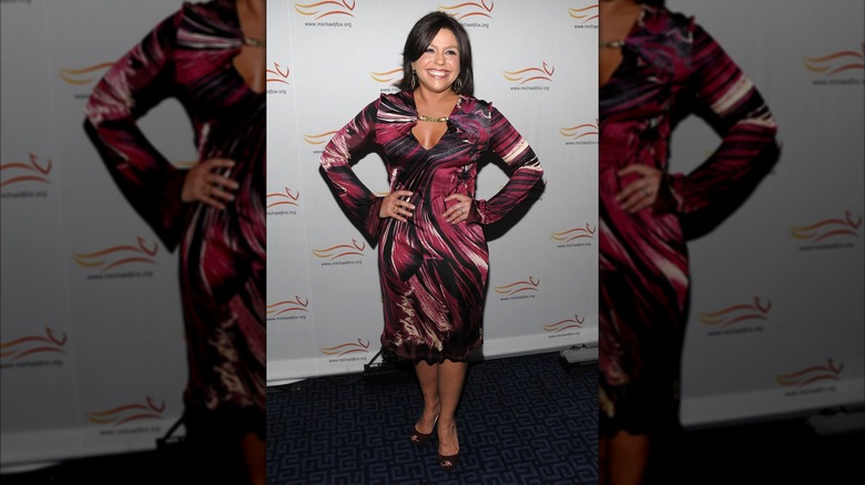 Rachael Ray smiling in a tie-dye dress.