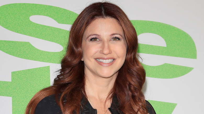 Rachel Nichols smiling on red carpet