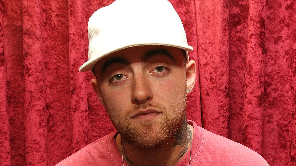 Mac Miller wearing a white cap