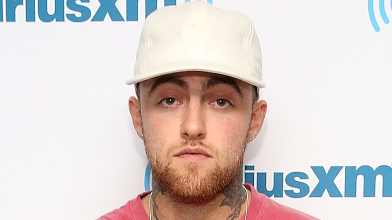 Mac Miller wearing a pink shirt