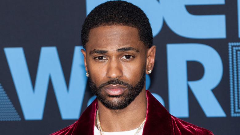 Big Sean wearing a purple jacket