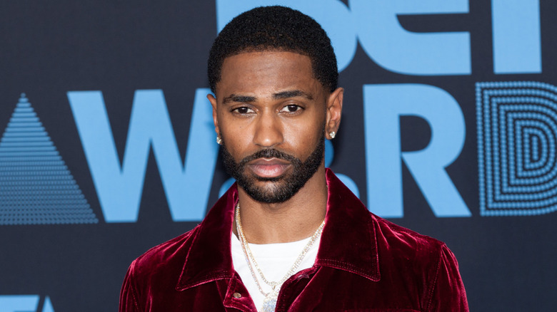 Big Sean wearing a purple jacket