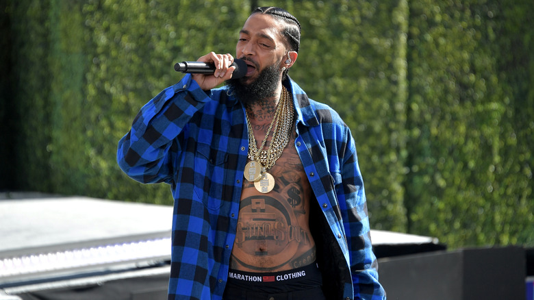 Nipsey Hussle performing with mic