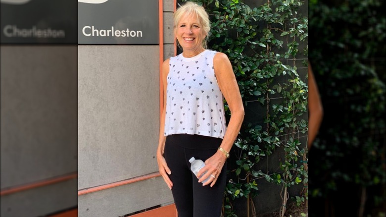 Jill Biden posing outside a barre class.