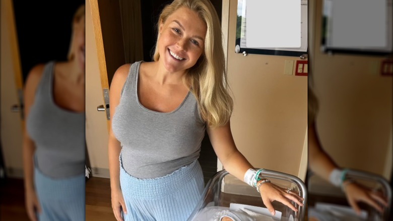 Karoline Leavitt posing with her newborn son Niko in hospital.