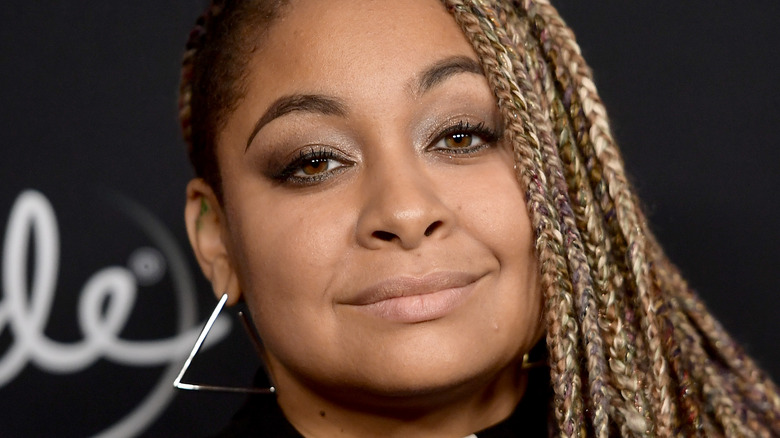 Raven-Symoné smiling at a red carpet event