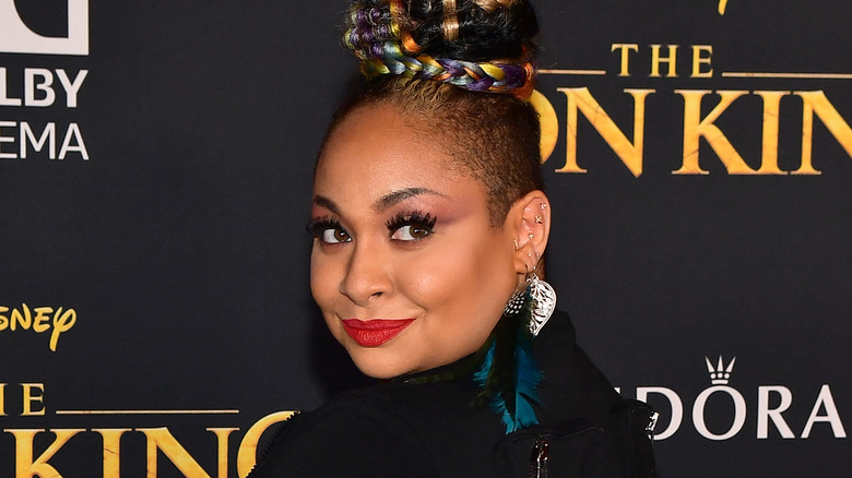 Raven-Symoné smiling at a red carpet event