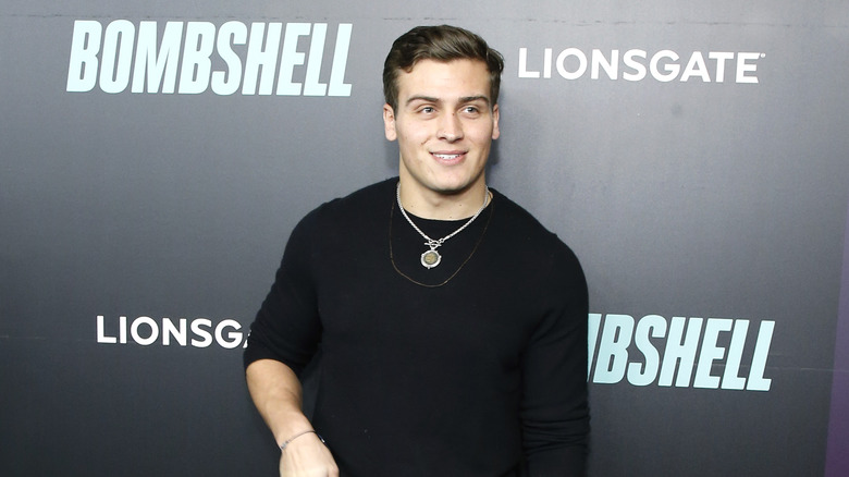 Frank Catania Jr. posing at a movie premiere 
