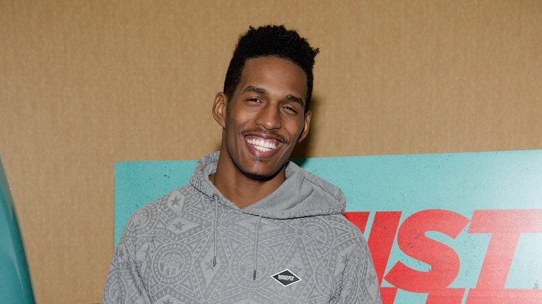 Kairo Whitfield smiling in a hoodie