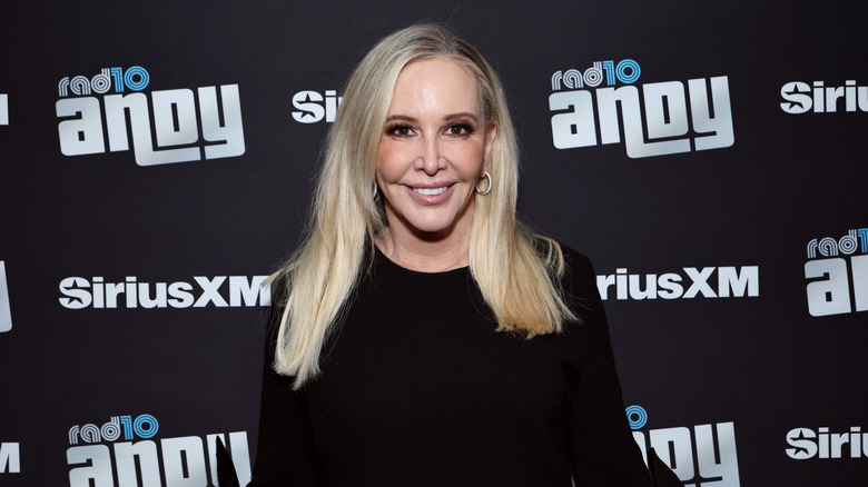 Shannon Beador smiling on step-and-repeat