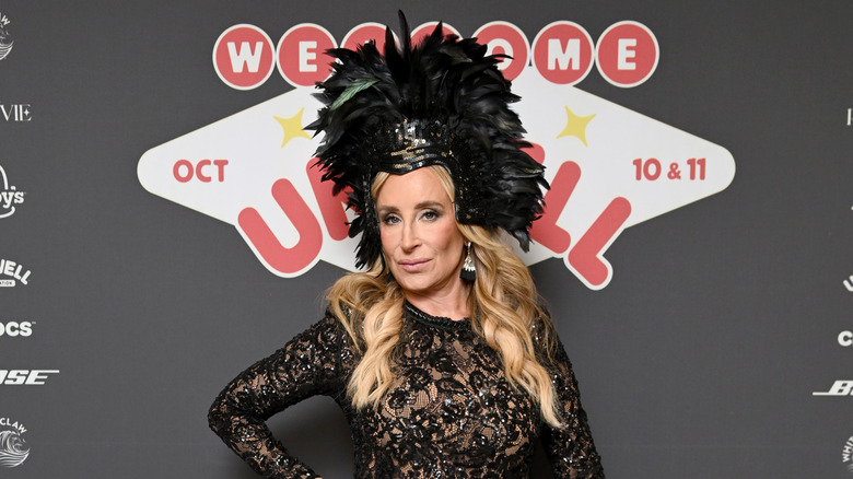 Sonja Morgan posing in ostentatious feathered head piece