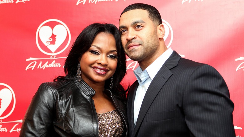 Phaedra Parks and Apollo Nida posing at an event