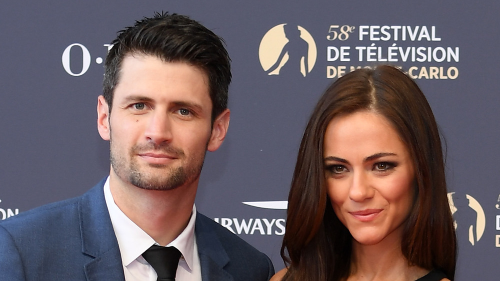 James Lafferty and Alexandra Park posing