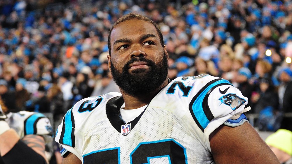 Michael Oher in football uniform, on field