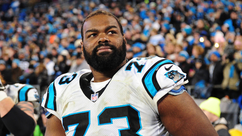 Michael Oher in football uniform, on field