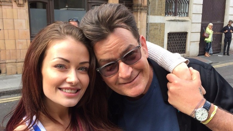 Jess Impiazzi with arm around Charlie Sheen