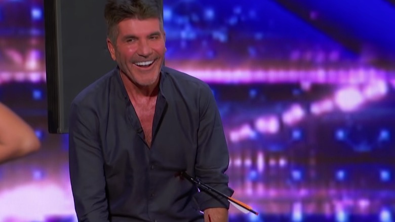 Simon Cowell laughing