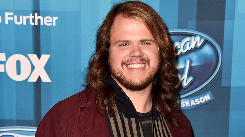 Caleb Johnson posing at American Idol event