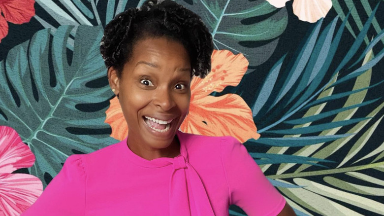 J'Tia Hart in front of a painted wall