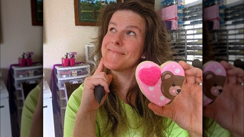Jen Yemola posing with heart shaped cookie