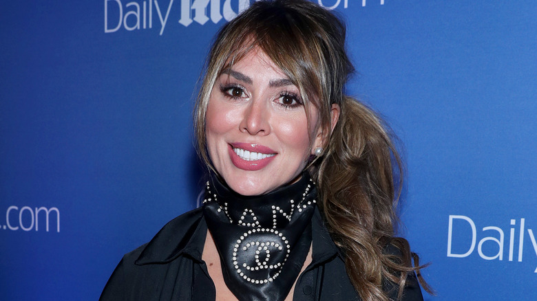 Kelly Dodd posing at an event