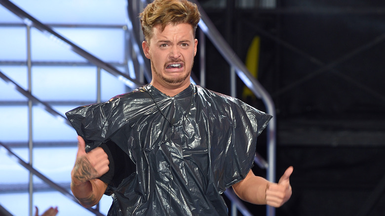 Ryan Ruckledge wearing a garbage bag