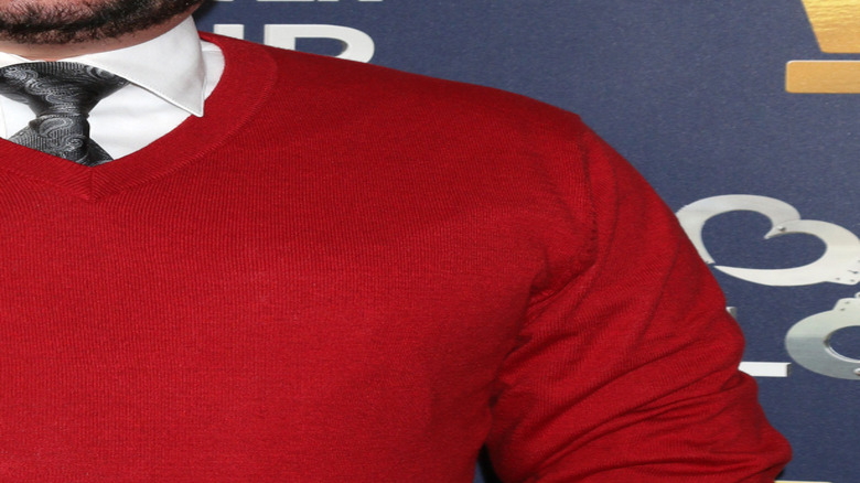 Jon Gosselin smiles in red sweater