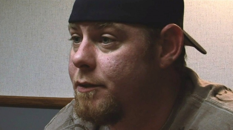 Justin Tennison speaking in hat