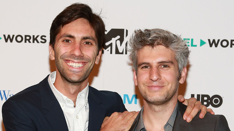 Nev Schulman and Max Joseph posing and smiling at an event