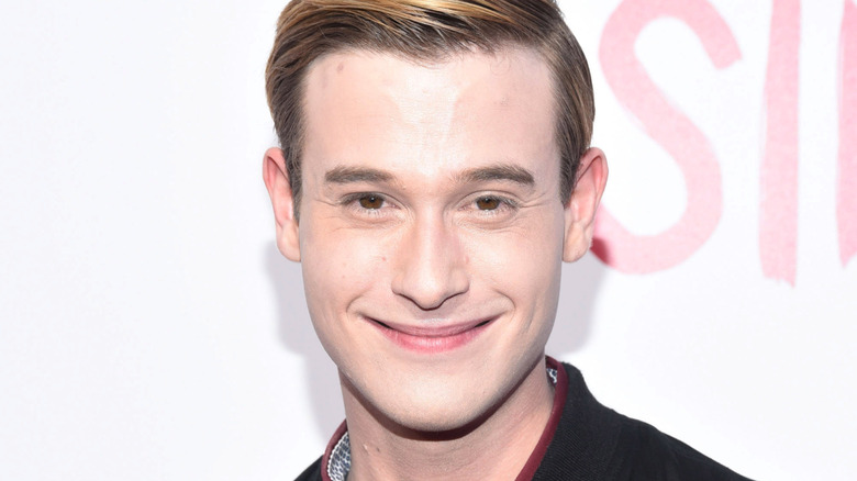 Hollywood Medium's Tyler Henry smiles