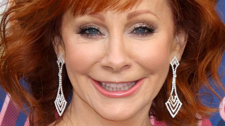 Reba McEntire smiling on the red carpet